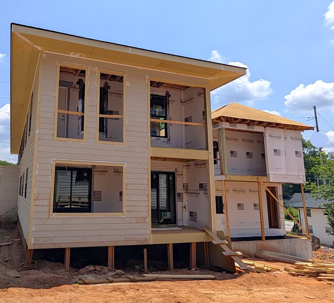 Framing and siding progress on duplex units at Brawley Commons