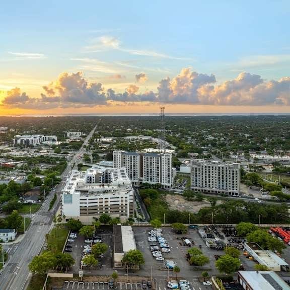 Aerial view of Alvista Bay Pointe and its parking garage at sunset