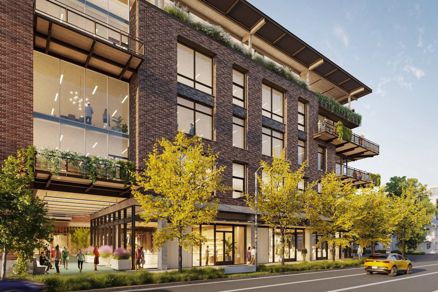 Street-level rendering of 5th & Walsh showing office floors with planted terraces