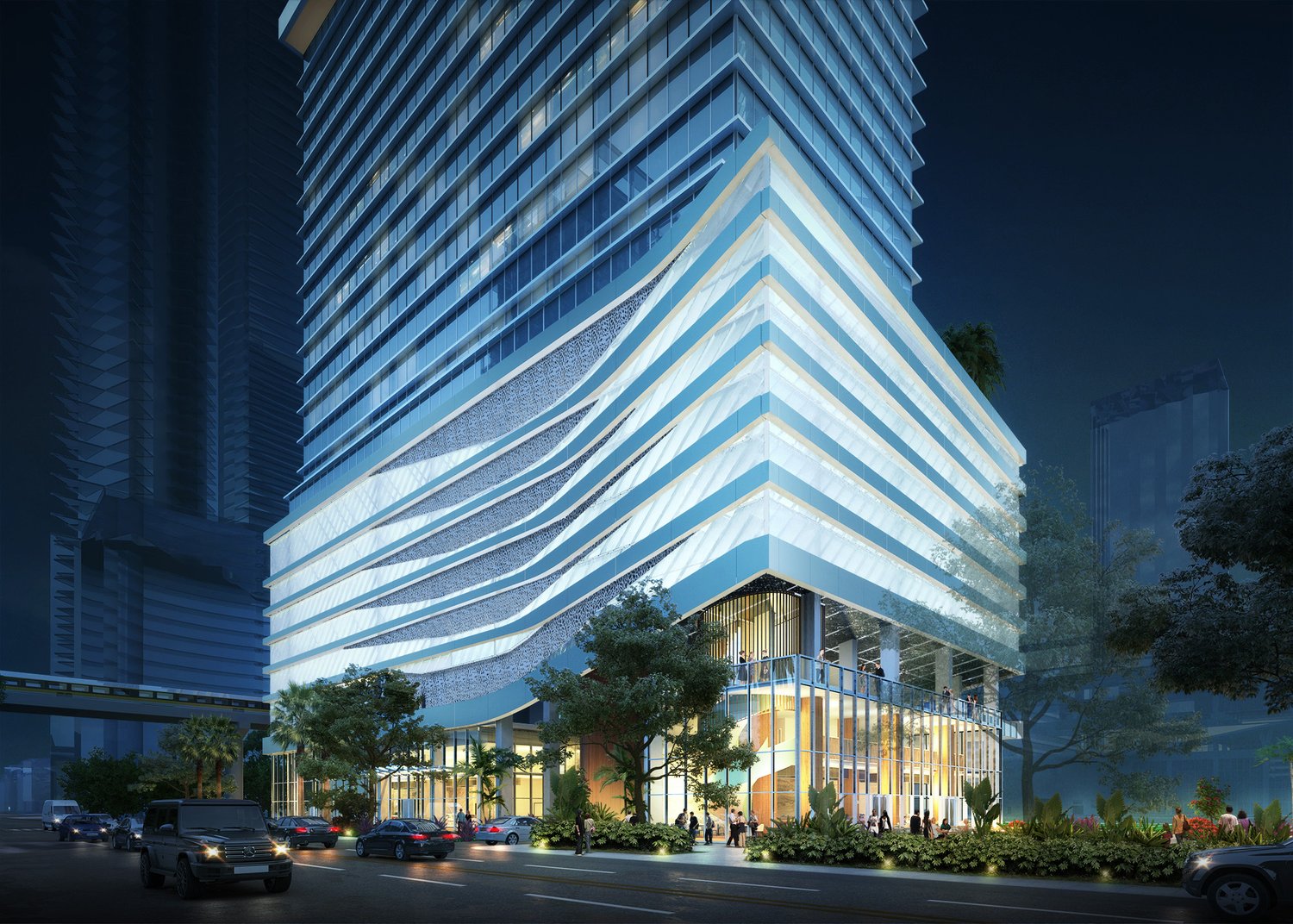 Street-level night rendering of the tower's illuminated podium at 988 NE 2nd Avenue