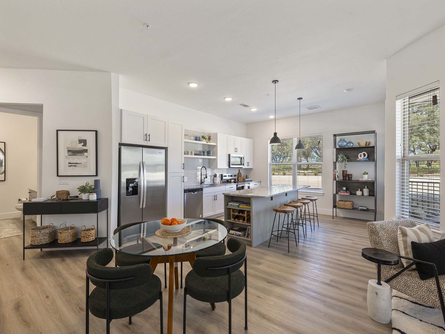 Model kitchen and dining area inside a residence at The Evergrove at Crystal Village