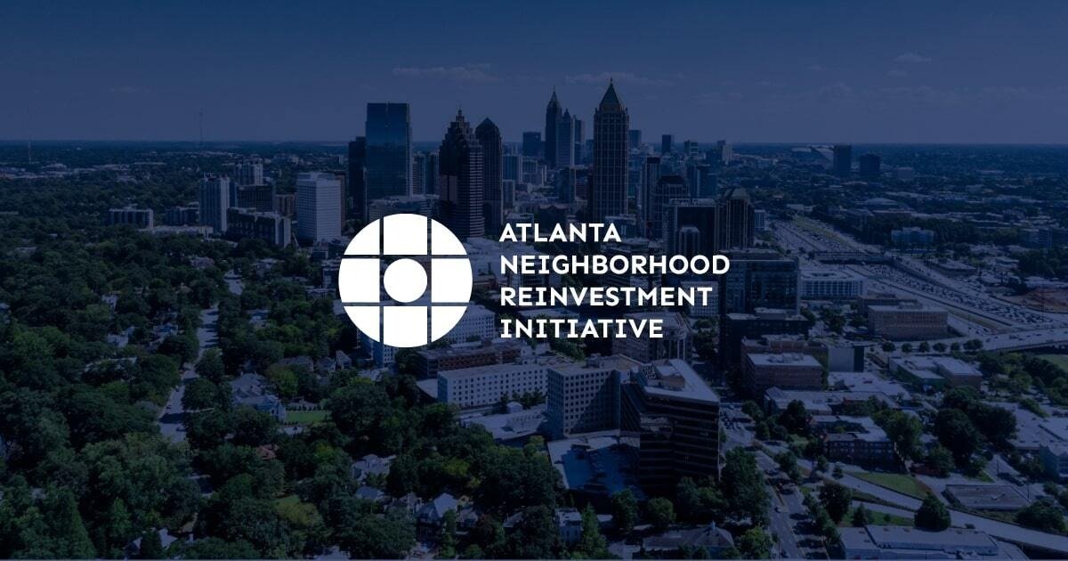 Atlanta Neighborhood Reinvestment Initiative program branding over the city skyline