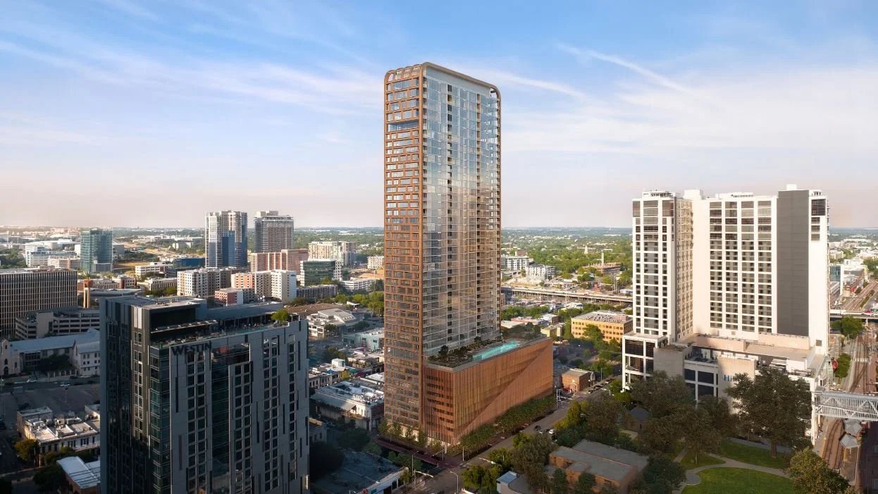Rendering of Wilson Tower's glass-and-bronze facade and podium amenity deck