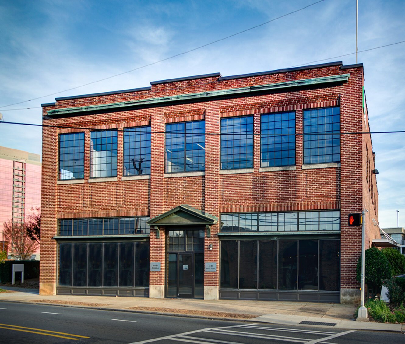 The Fowler Building at 1447 South Tryon St, a historic brick warehouse proposed for boutique hotel conversion