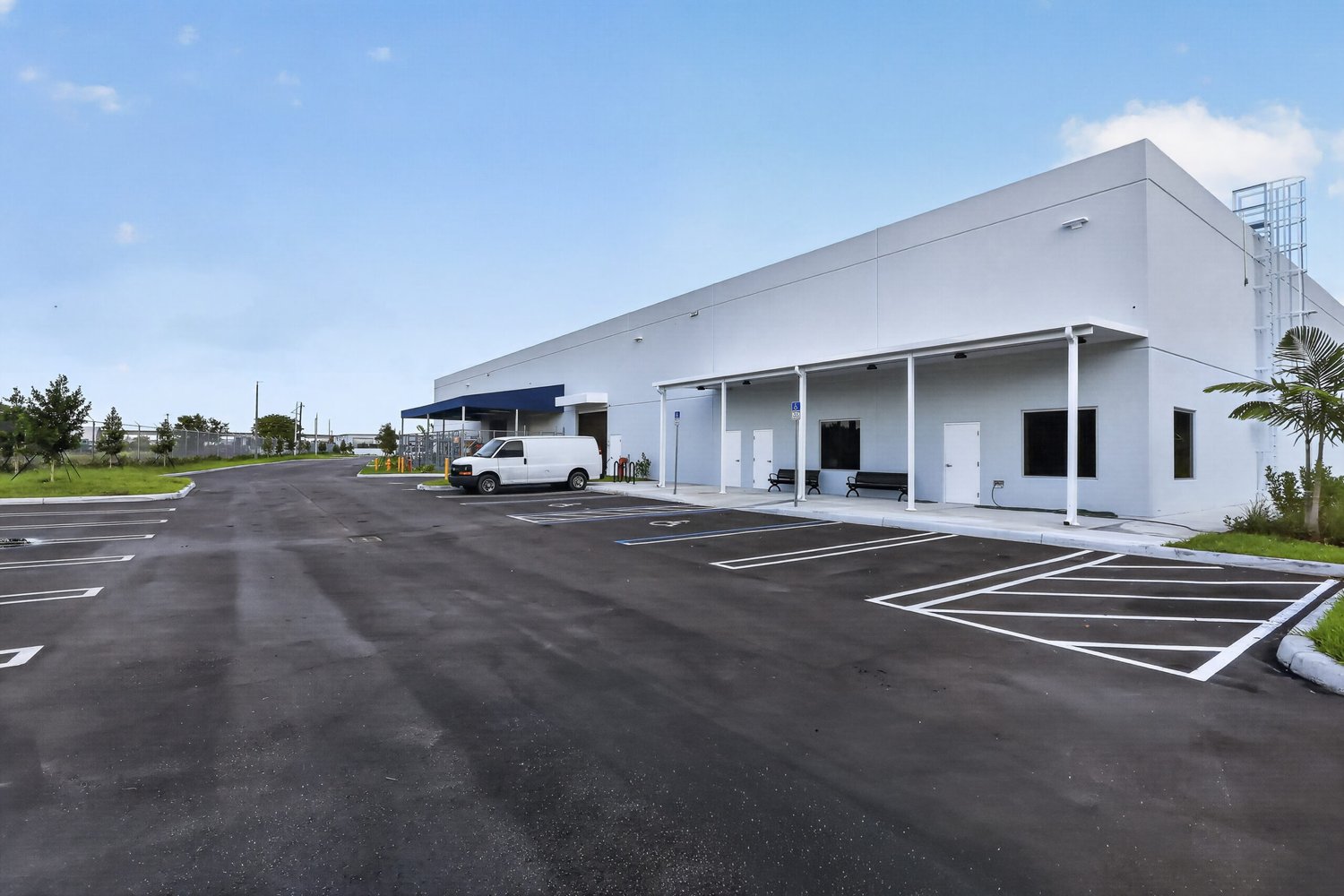 Parking and covered entry at the completed SG Holdings warehouse in Miami-Dade