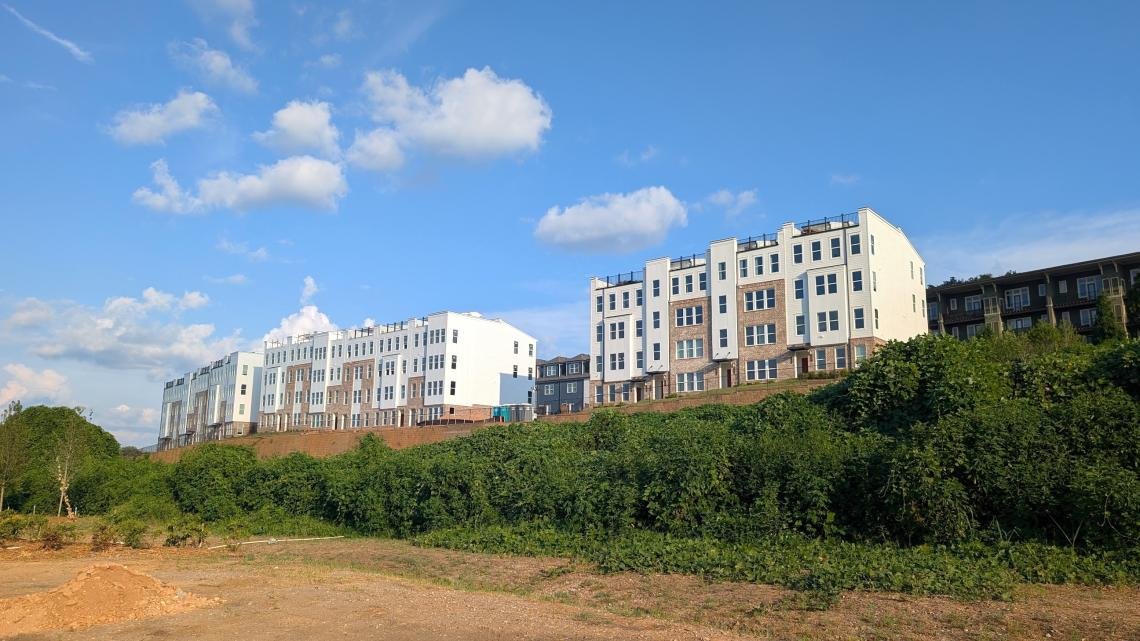 Skylar condos rising on a hillside above the Southside BeltLine corridor